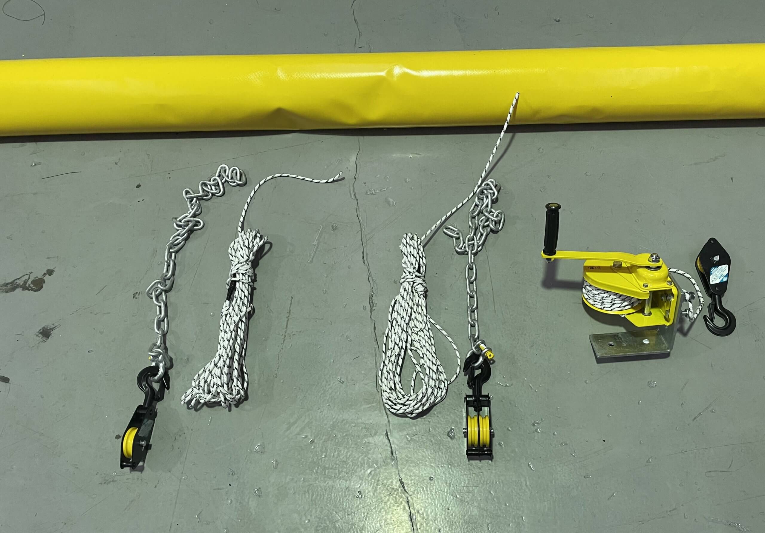 FlexReg hanging kit components including ropes, chains, pulleys and manual winch for underground installation and adjustment.