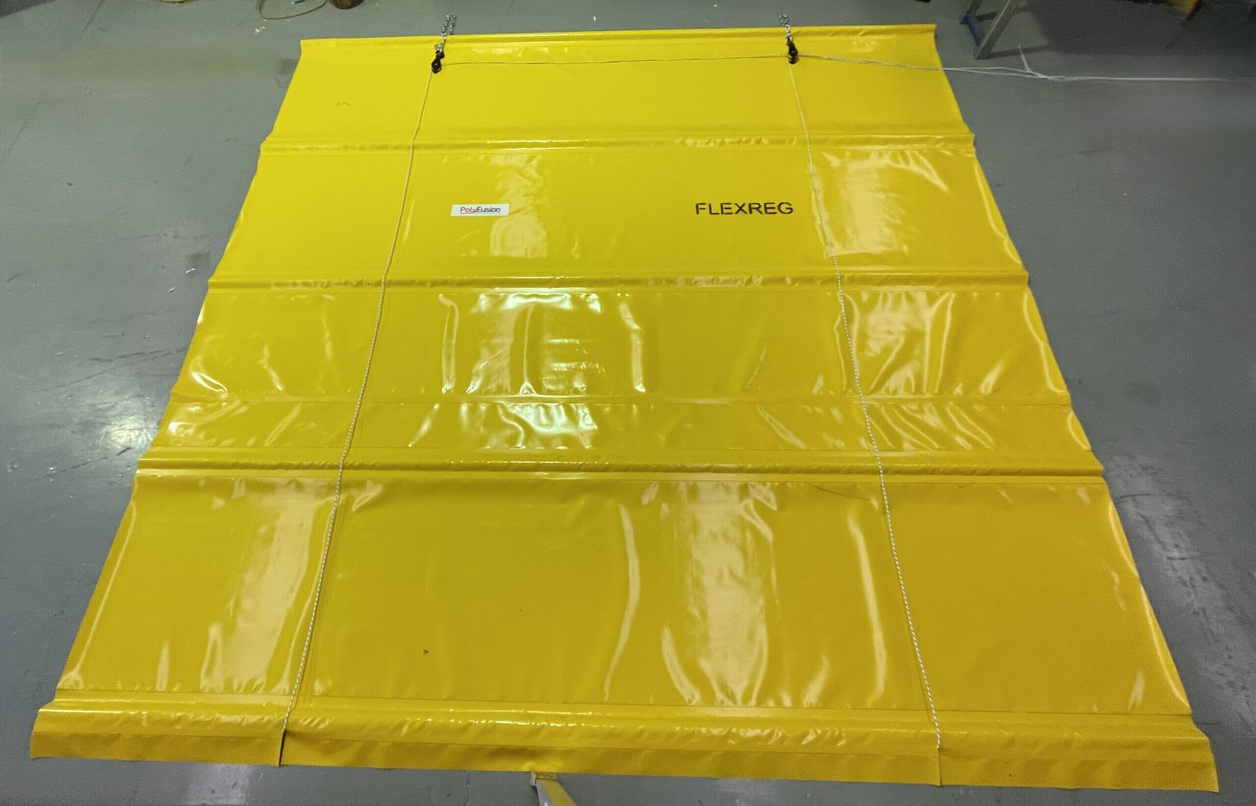 FlexReg mine ventilation regulator laid out in the PolyFusion workshop showing the flexible curtain and support ribs.