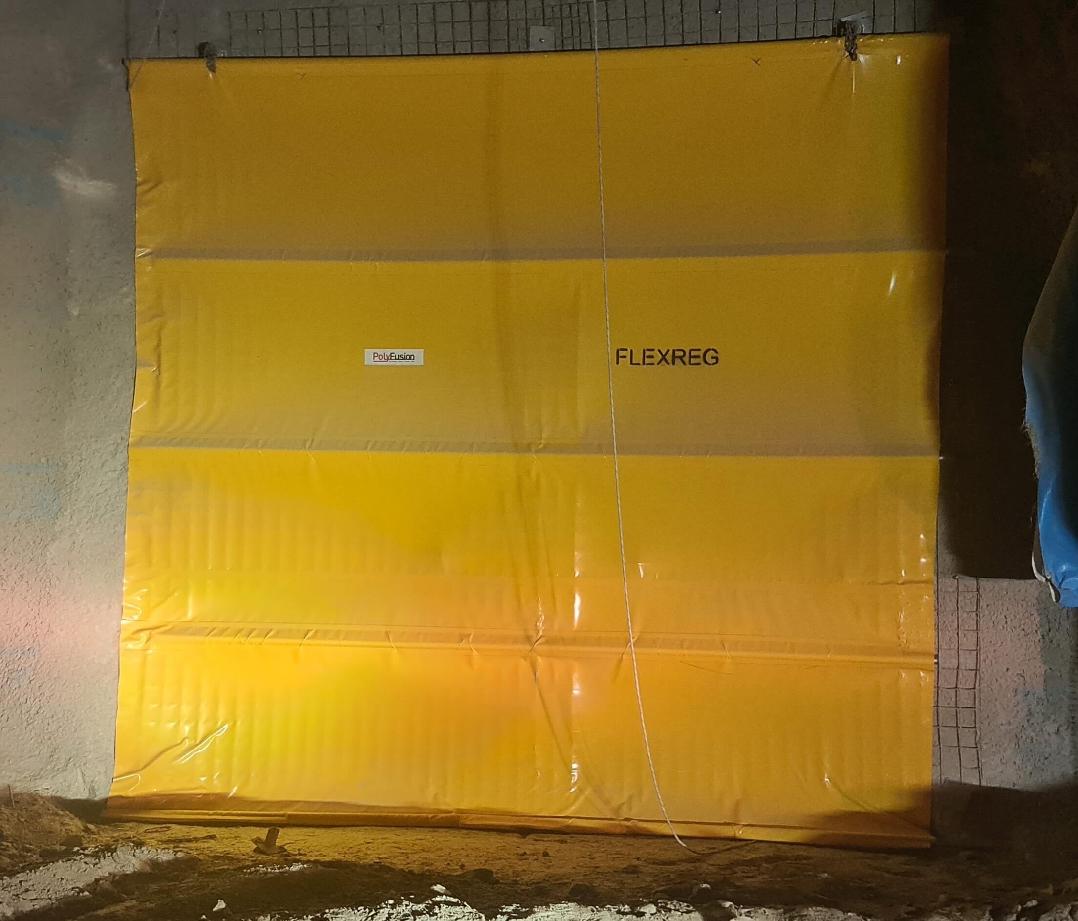 FlexReg adjustable mine ventilation regulator, commonly known as a Nixon flap, installed underground.